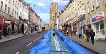 PARK AND SLIDE – ARTIST TO TURN STREET INTO WATERSLIDE